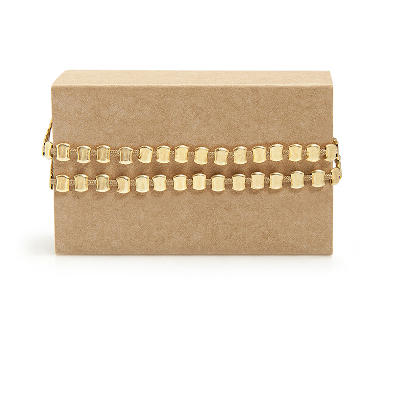 Stops Gold Double Stops Gold Double - 2 rows of Stops!! Small silver balls that have been pressed by hand one by one to create this special but easy-to-wear bracelet. Wear it alone and many rows together. Closes with a macramé wrist clasp.
Material: Gold-plated silver 925 with beige cord